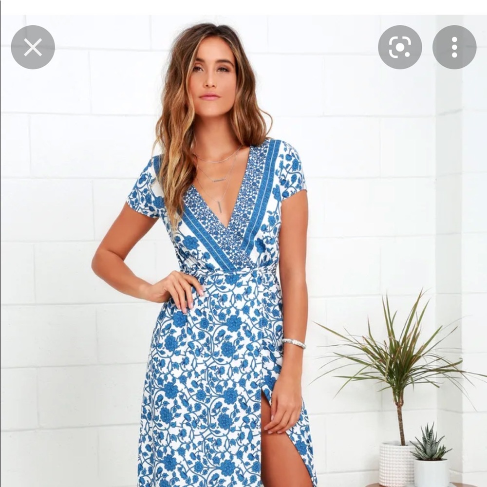 Flattering blue floral wrap dress with slit